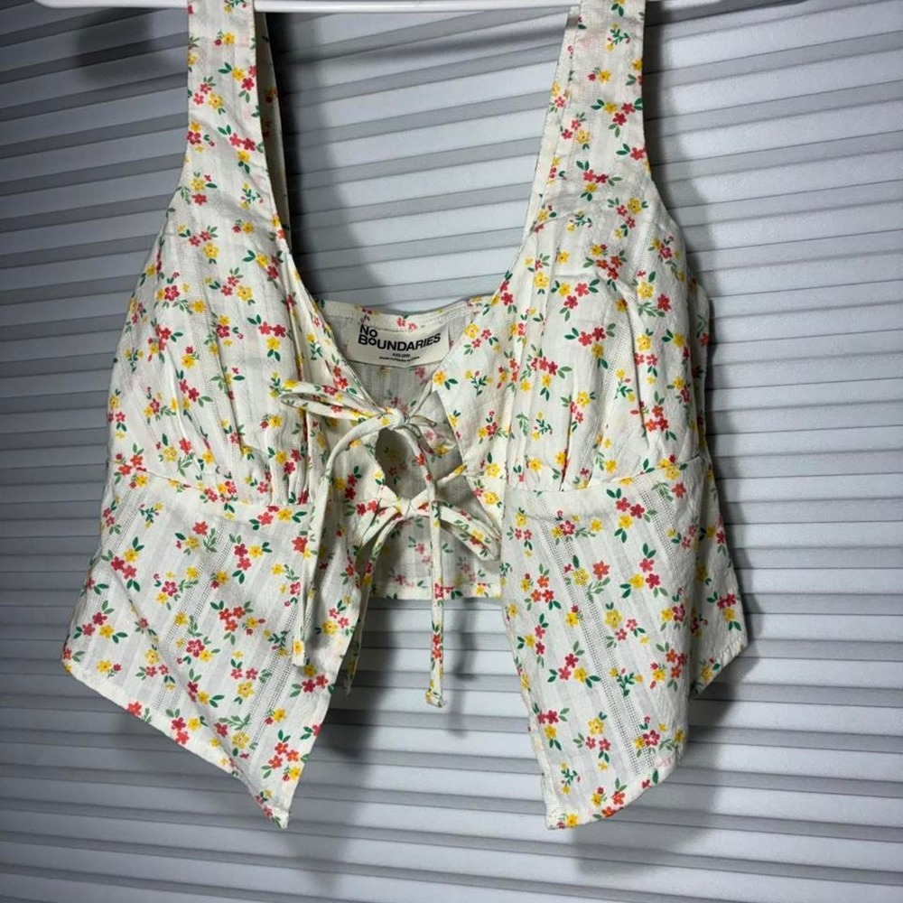 white floral crop top with small red, yellow, and green flowers
